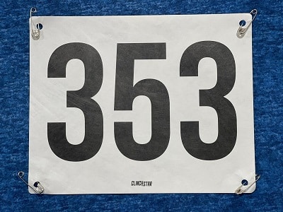 What is the proper way to put on a running bib? | Clinch Star